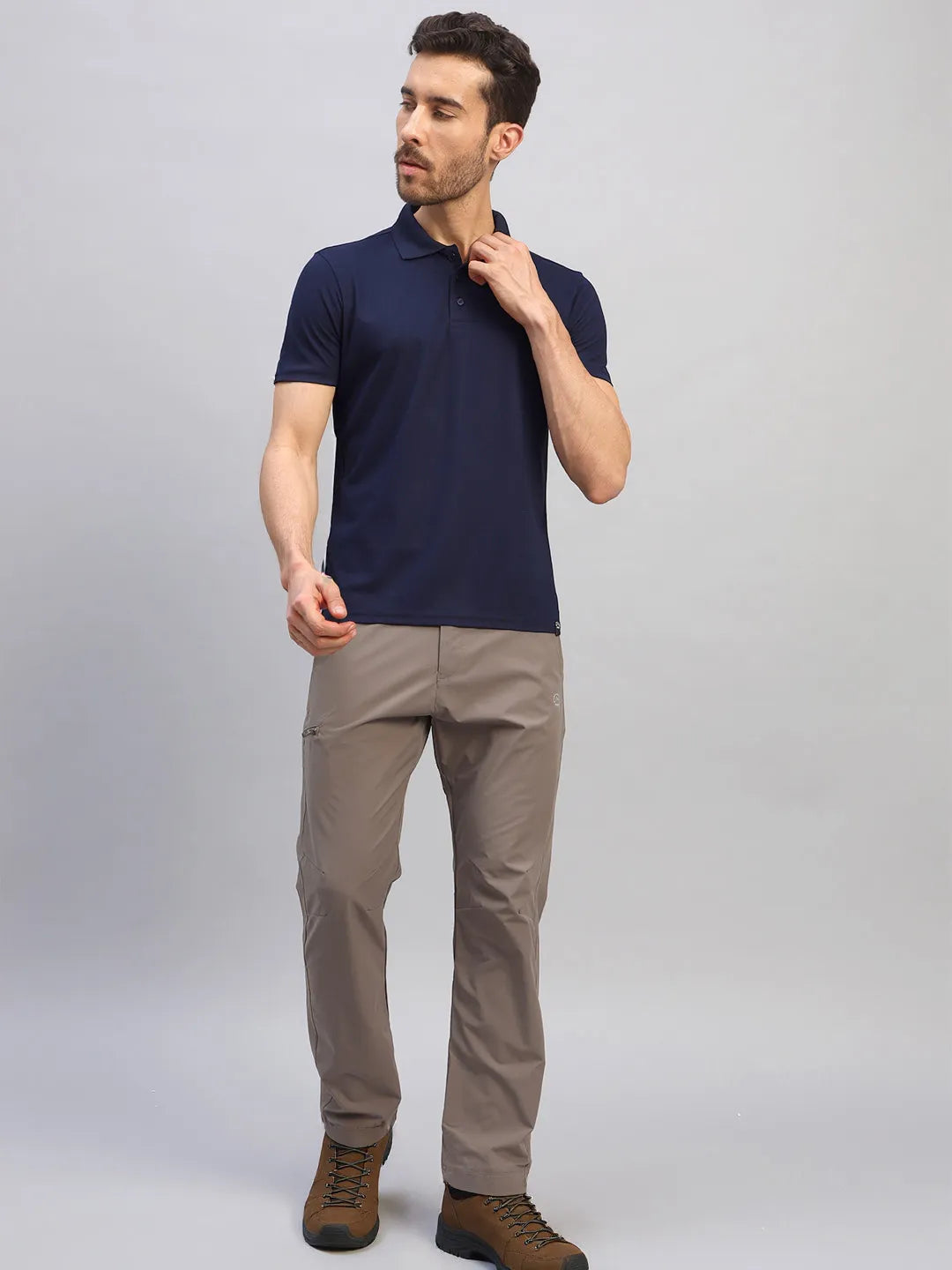 Man wearing the Reccy Men's Navy Blue Polo T-Shirt, full length front view